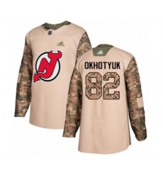 Youth New Jersey Devils #82 Nikita Okhotyuk Authentic Camo Veterans Day Practice Hockey Jersey